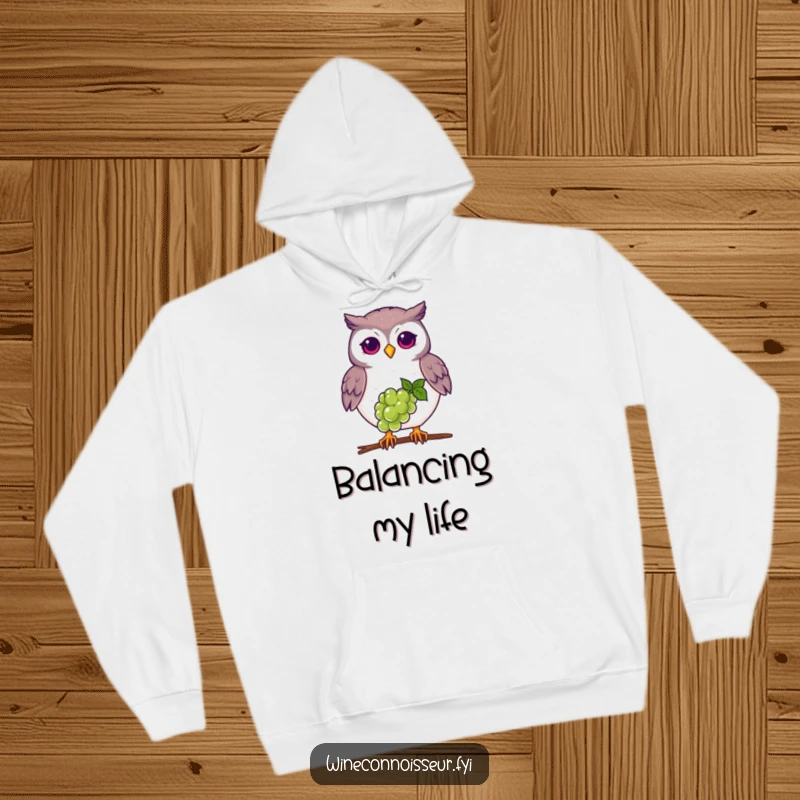 Funny proud owl hoodie, balancing grape on beak, cozy and wise graphic for bird lovers.