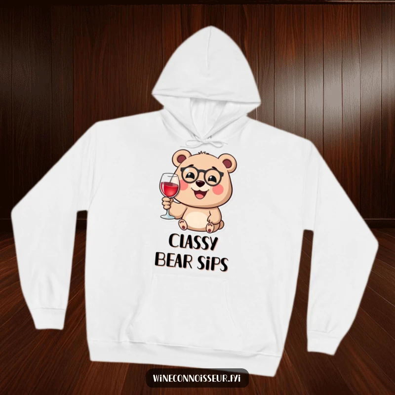 Funny hoodie with a happy bear wearing a monocle, smiling while holding a wine glass, offering cozy humor.