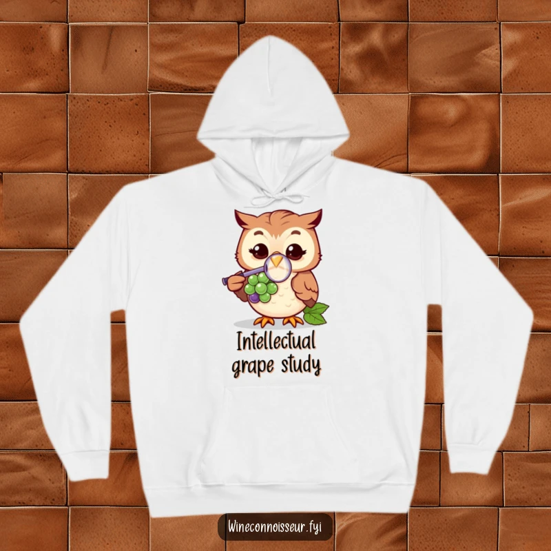 Funny hoodie with a cheerful owl character using a magnifying glass to examine a grape, showcasing a humorous investigation. Cozy and comical.
