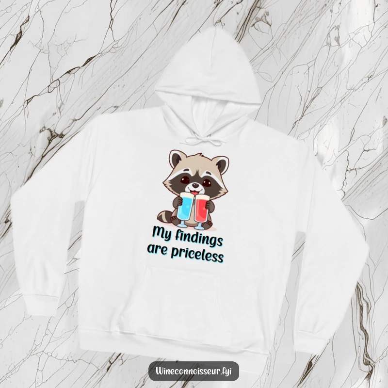 Funny hoodie depicting a cheerful raccoon comparing two different colored liquid samples in lab flasks, a humorous take on scientific discovery.