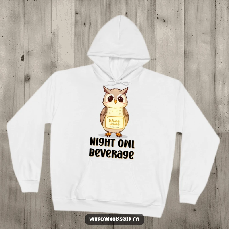 Funny hoodie featuring a kawaii owl gently illuminating a wine label, offering cozy and wise humor.